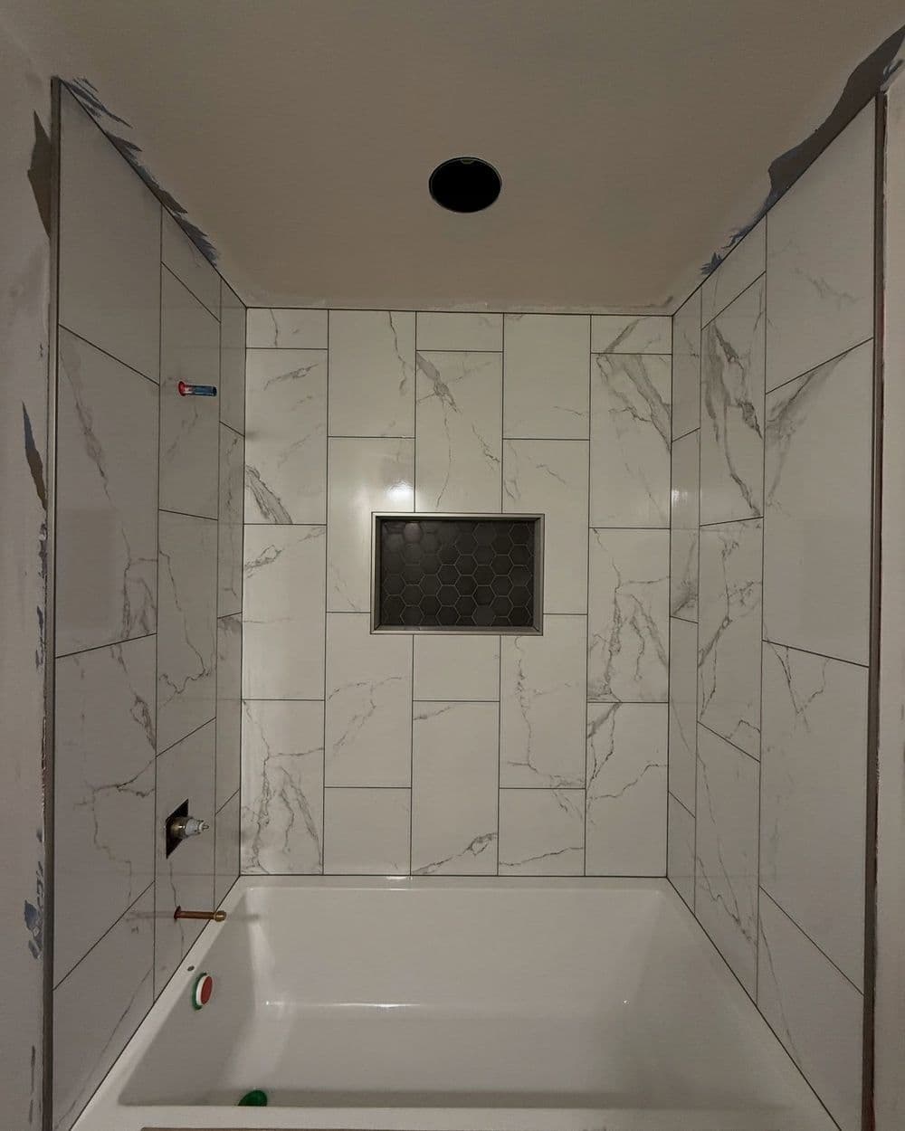 Project Bathroom Remodel with Sleek Tub Surround and Tile Floor image